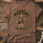 Brown t-shirt with beagle dog wearing hunting vest and holding rifle, "Gone Hunting Dog House Hunt Club" text.