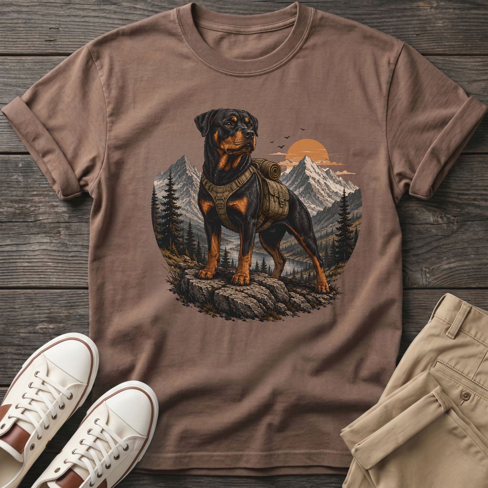 T-shirt with Rottweiler wearing a backpack in a mountain landscape.