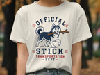 White t-shirt with husky holding stick and text "OFFICIAL STICK TRANSPORTATION DEPT".
