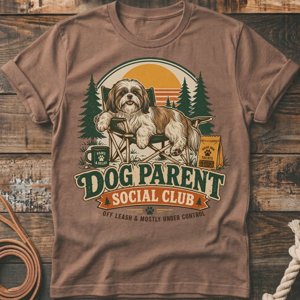Shih Tzu relaxing in a chair with "Dog Parent Social Club" text.