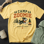 Yellow t-shirt with "CAMP ZOOMIE CERTIFIED TRAIL SPRINTER" text and cartoon dog.
