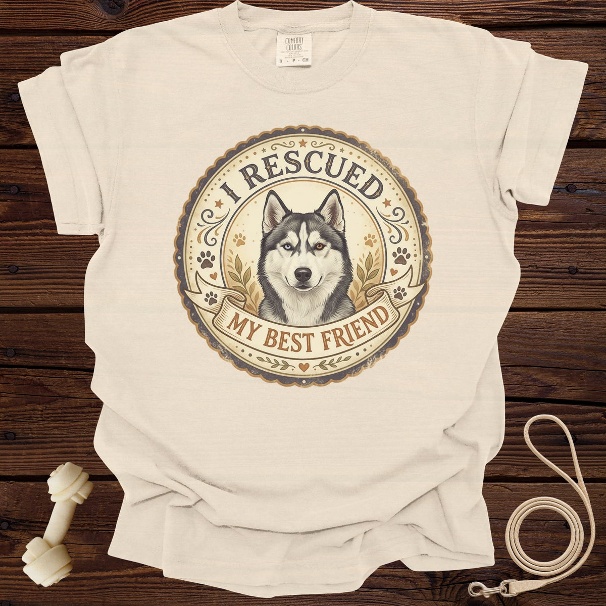 Cream t-shirt with a husky graphic that says "I RESCUED MY BEST FRIEND".