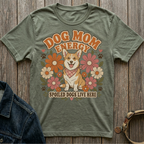 Green t-shirt with a smiling corgi, flowers, and text "DOG MOM ENERGY" and "SPOILED DOGS LIVE HERE".