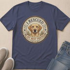 Navy t-shirt with a circular graphic of a golden retriever and the text "I Rescued My Best Friend".