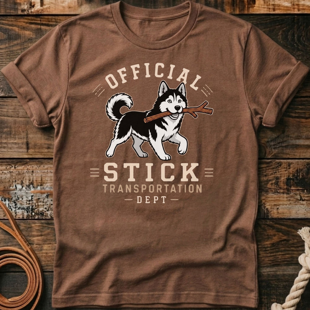 Brown t-shirt with husky carrying stick, text "OFFICIAL STICK TRANSPORTATION DEPT".