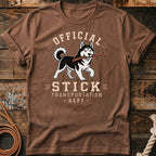Brown t-shirt with husky carrying stick, text "OFFICIAL STICK TRANSPORTATION DEPT".