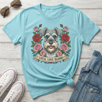 Light blue t-shirt with Schnauzer dog art and banner reading "Loyal Love Blooms."