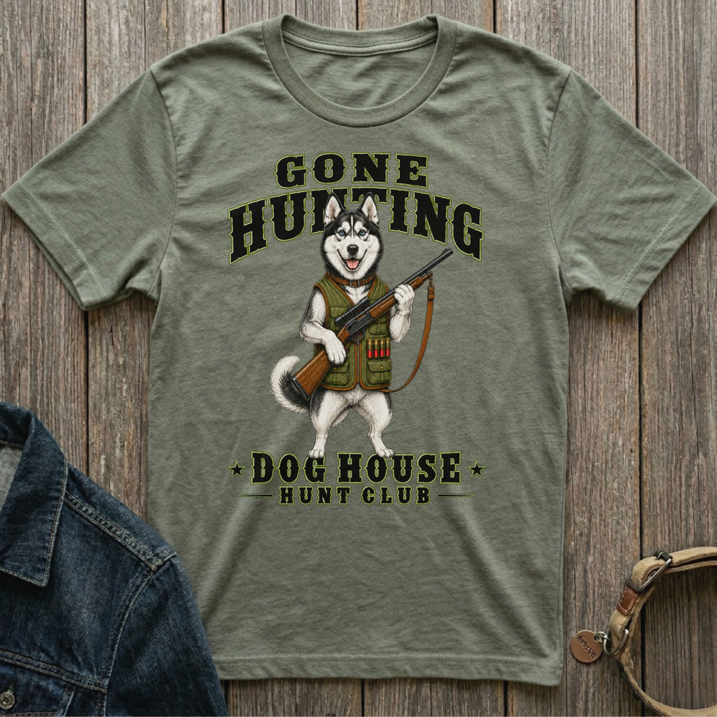 Green t-shirt with a husky dressed as a hunter, holding a rifle. Text reads "Gone Hunting Dog House Hunt Club".