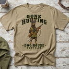 T-shirt with a Doberman holding a shotgun, text "GONE HUNTING DOG HOUSE HUNT CLUB".