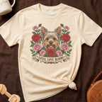 Cream t-shirt with a Yorkshire terrier illustration surrounded by roses and the text "LOYAL LOVE BLOOMS".