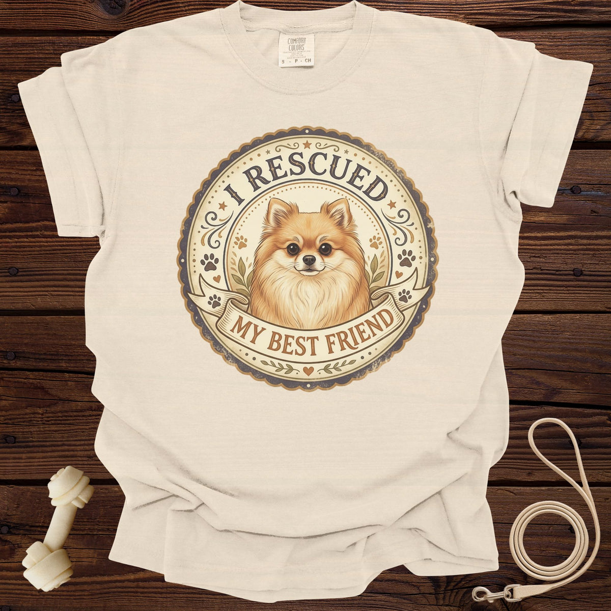 Cream t-shirt with "I Rescued My Best Friend" graphic featuring a Pomeranian.