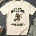 Cream t-shirt graphic featuring a husky holding a shotgun, with text "GONE HUNTING DOG HOUSE HUNT CLUB".