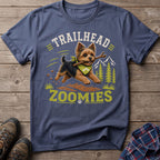 Yorkshire terrier with stick and bandana on shirt with text "Trailhead Zoomies."