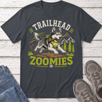 Husky with stick in mouth, text "TRAILHEAD ZOOMIES" on dark grey t-shirt.