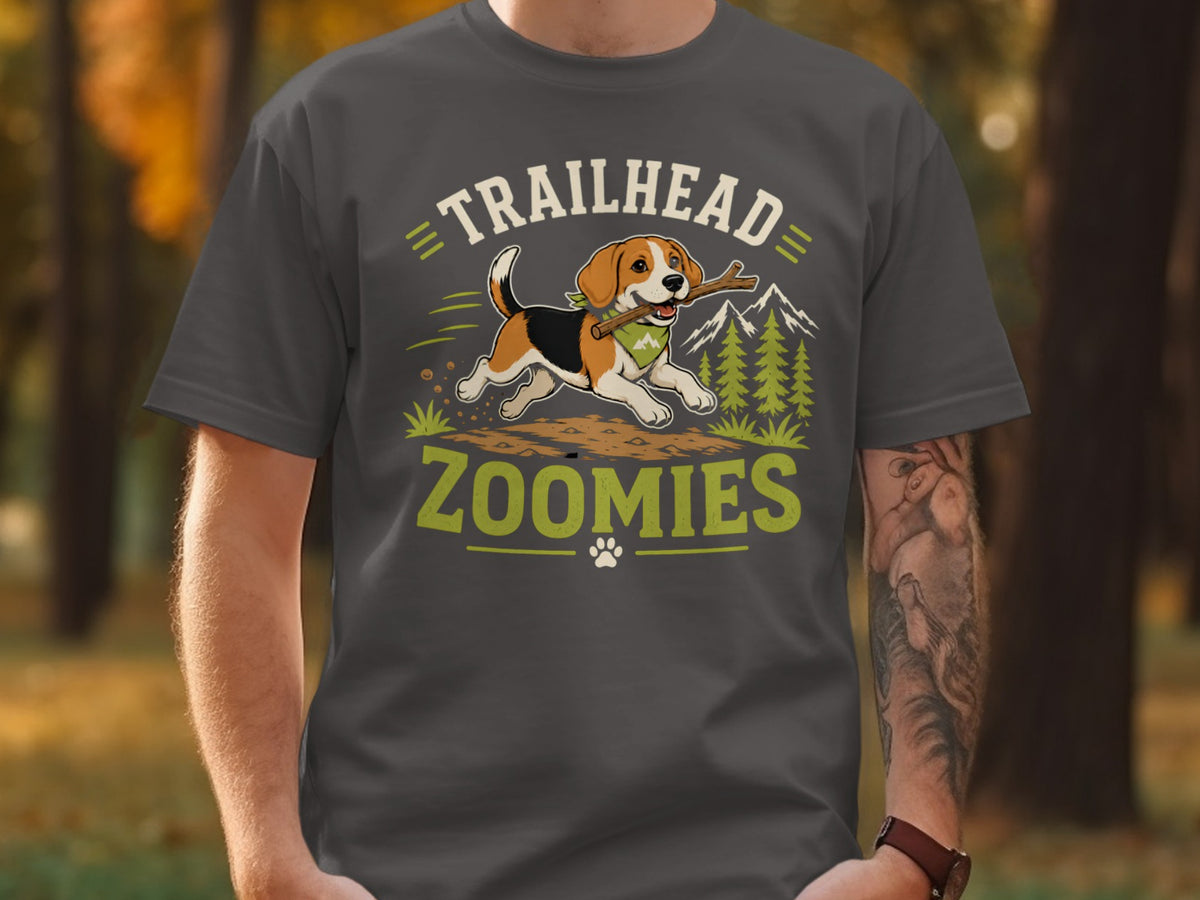 Beagle with stick on t-shirt reading "Trailhead Zoomies".