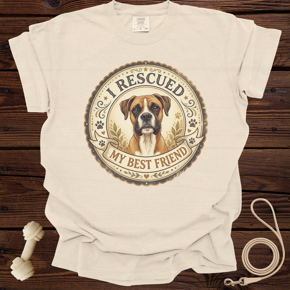 Cream t-shirt with circular graphic of a boxer dog and text "I RESCUED MY BEST FRIEND".