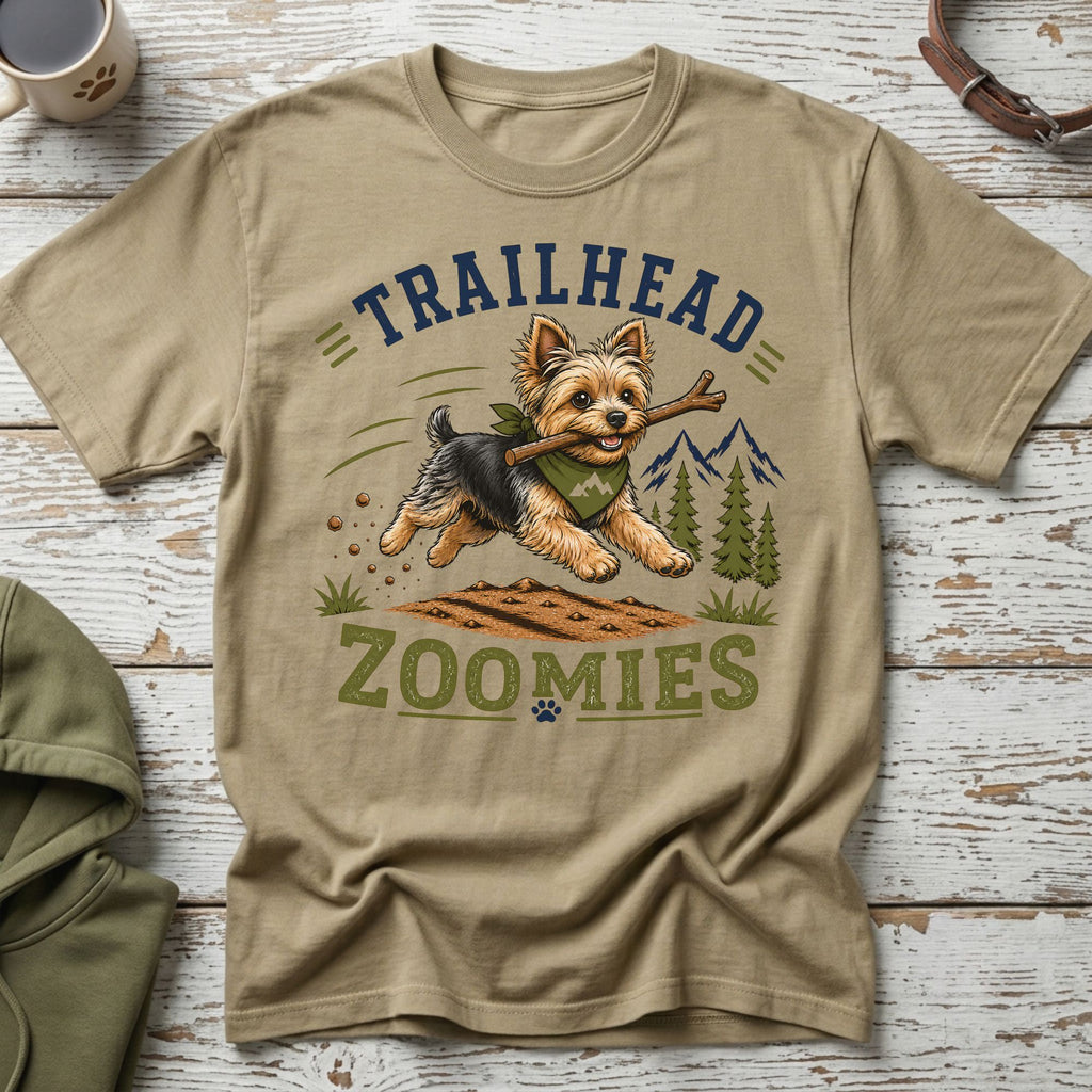Yorkshire terrier running with stick, text "TRAILHEAD ZOOMIES"