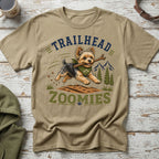 Yorkshire terrier running with stick, text "TRAILHEAD ZOOMIES"