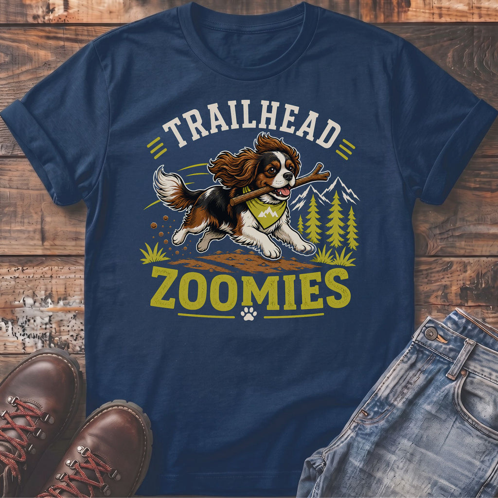 Navy t-shirt with a Cavalier King Charles Spaniel dog holding a stick, with text "TRAILHEAD ZOOMIES".