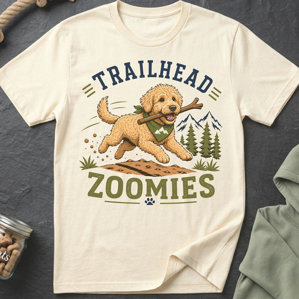 Cream t-shirt with graphic of running dog and text "Trailhead Zoomies".