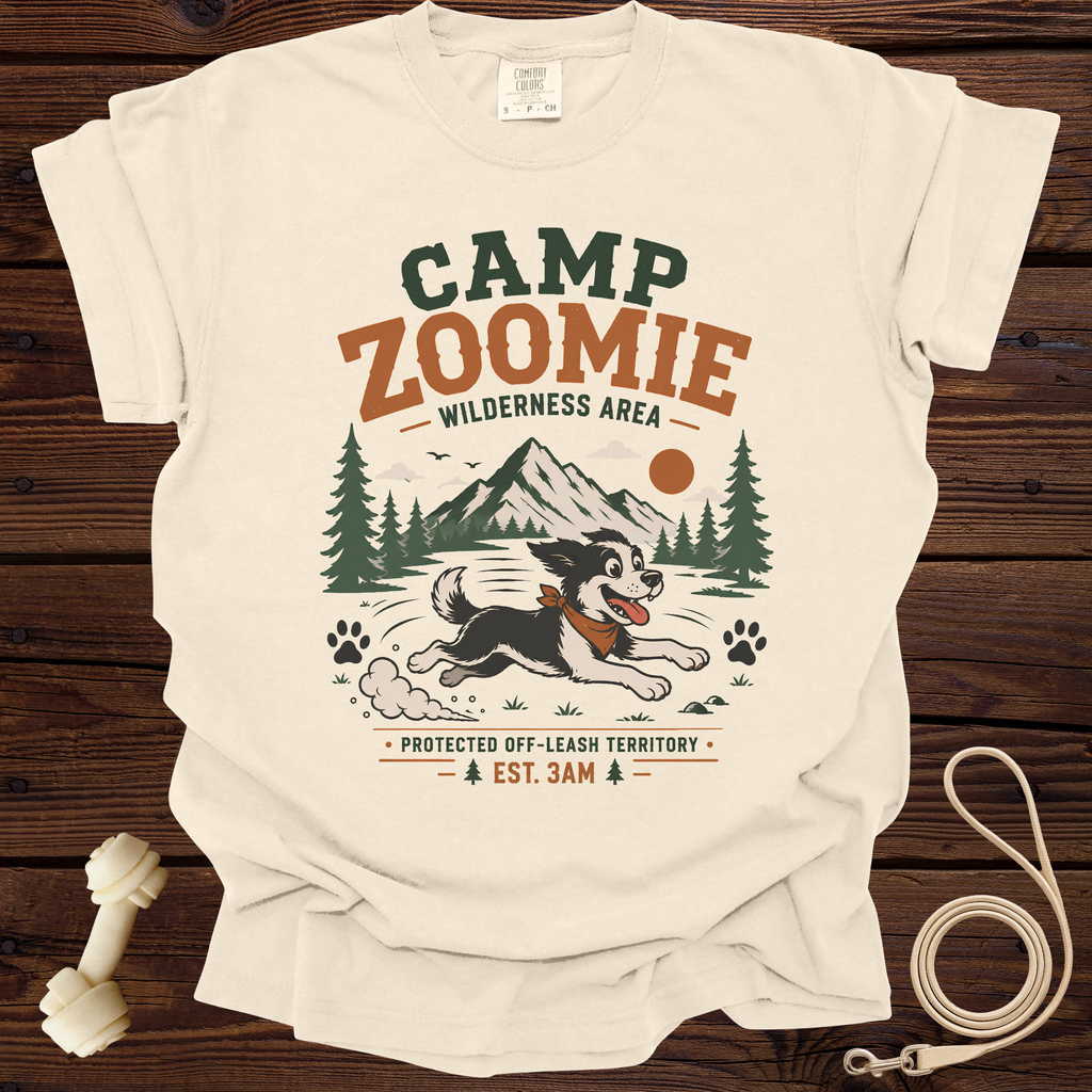 Cream t-shirt with "CAMP ZOOMIE WILDERNESS AREA" graphic and running dog.