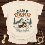 Cream t-shirt with "CAMP ZOOMIE WILDERNESS AREA" graphic and running dog.
