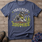 Schnauzer with stick and bandana, text "TRAILHEAD ZOOMIES", mountains, trees