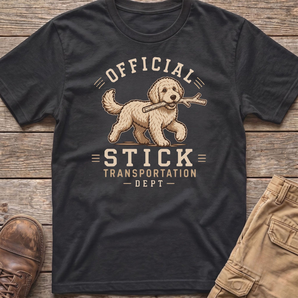 Dark gray t-shirt with a cartoon dog carrying a stick and text "Official Stick Transportation Dept."