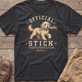 Dark gray t-shirt with a cartoon dog carrying a stick and text "Official Stick Transportation Dept."