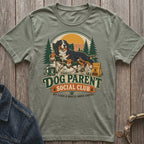 Bernese Mountain Dog relaxes in chair with "Dog Parent Social Club" text.