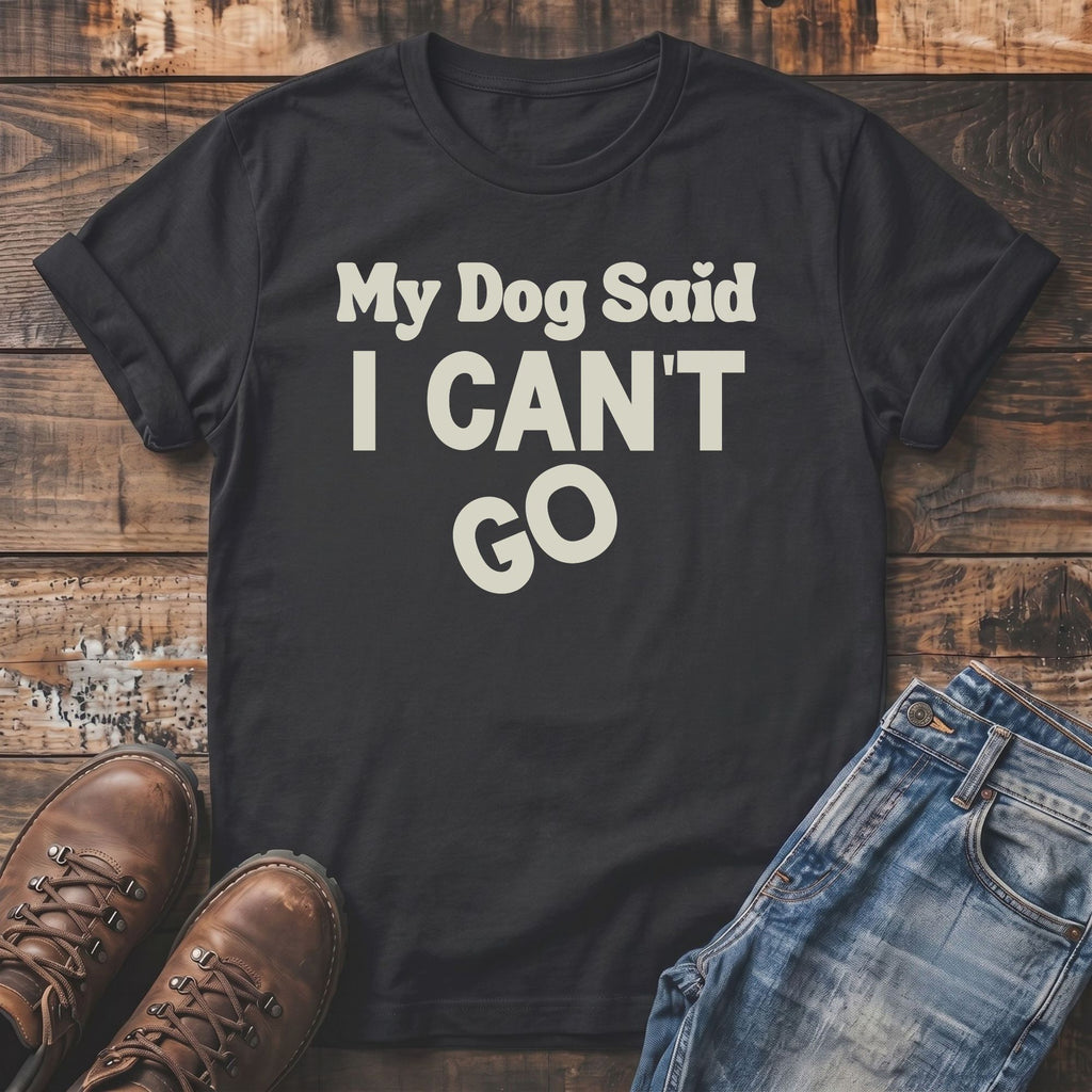 Black t-shirt with "My Dog Said I CAN'T GO" text, jeans, and boots.