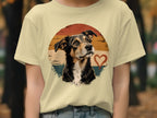 Dog portrait with retro sunset circle and heart graphic on a cream t-shirt.