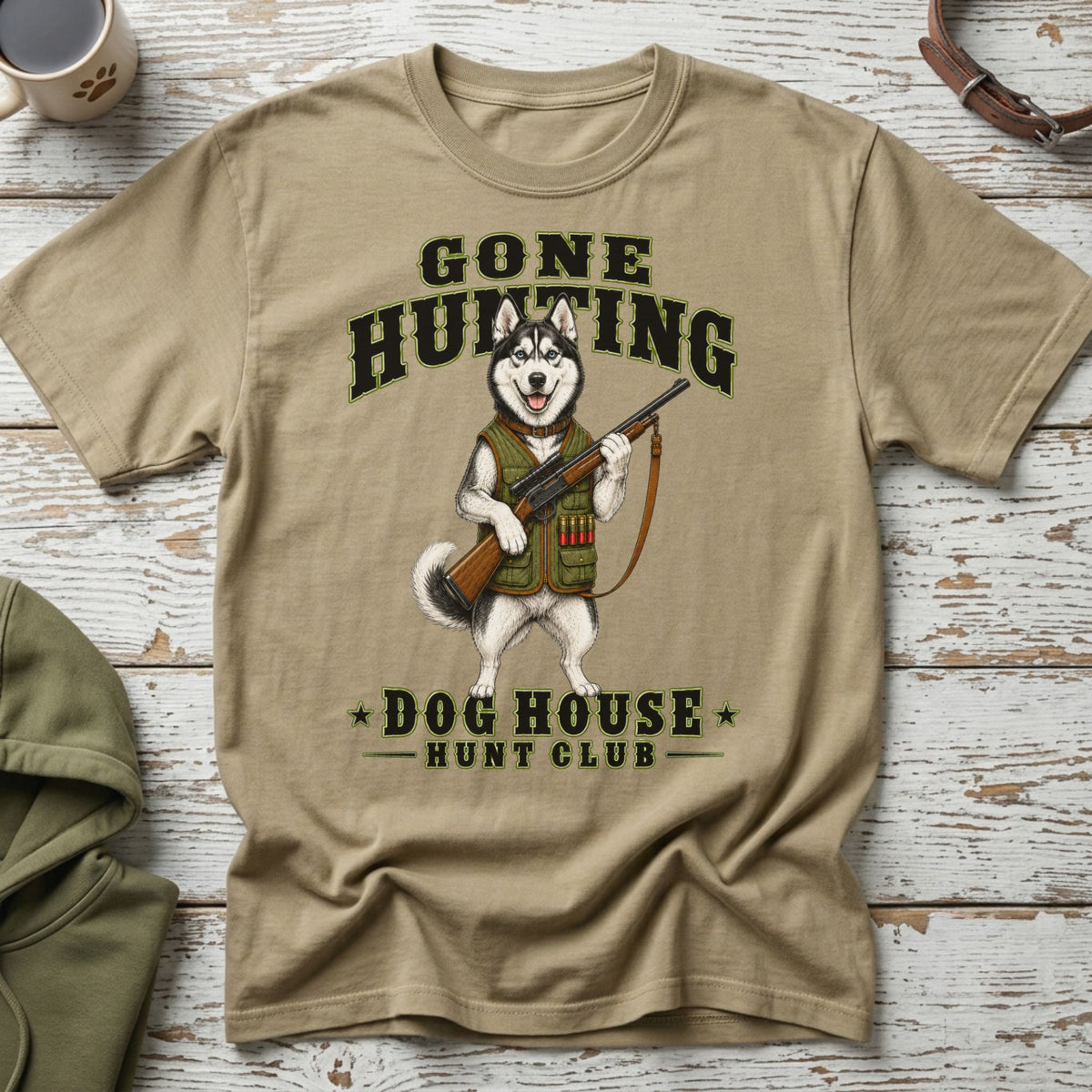 T-shirt with husky graphic, shotgun, and text "Gone Hunting Dog House Hunt Club."