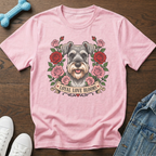 Pink t-shirt with a schnauzer surrounded by roses and the text "Loyal Love Blooms".