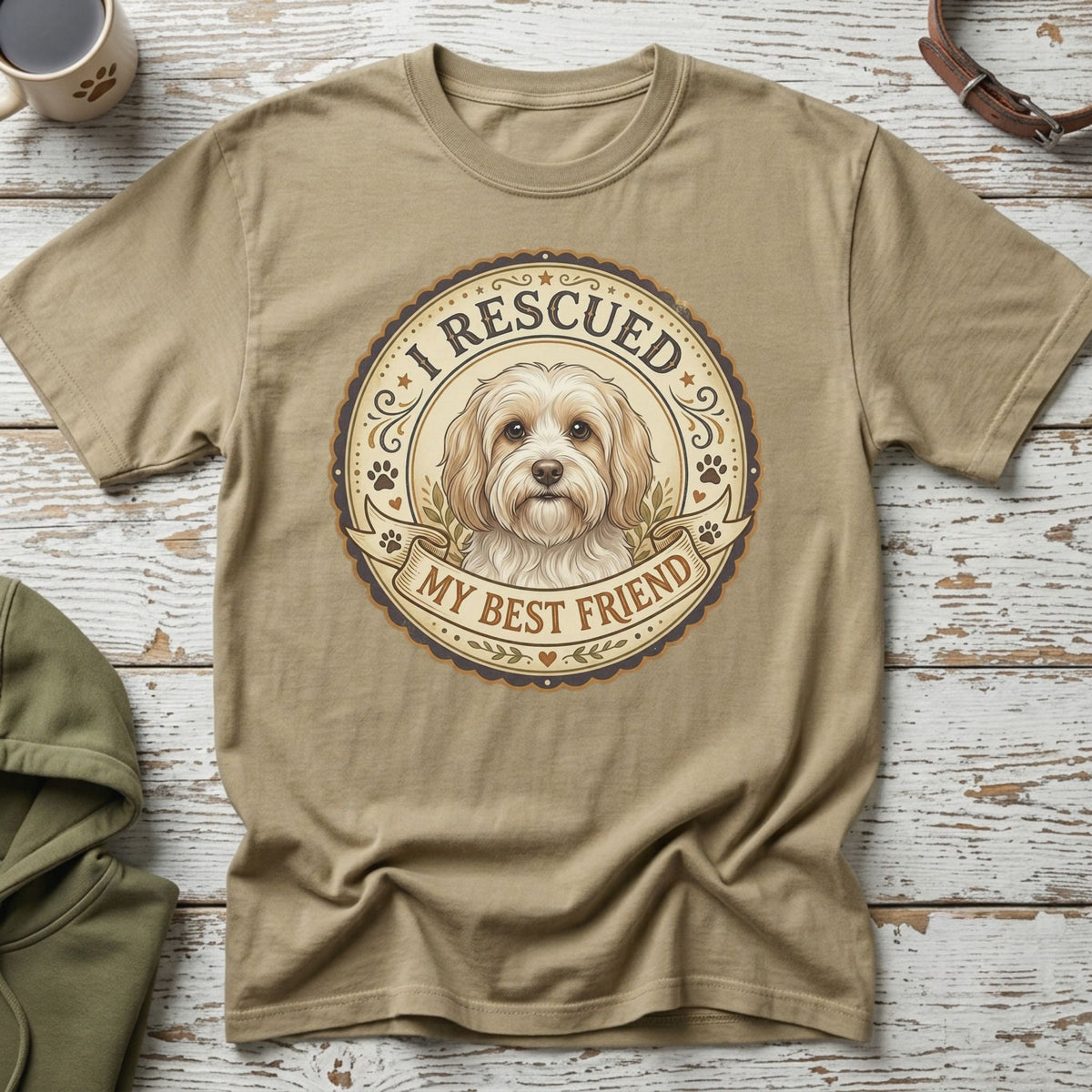 T-shirt with a round graphic featuring a dog, the text "I RESCUED MY BEST FRIEND".