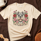 Schnauzer face with roses and banner text "Loyal Love Blooms".