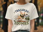 Chihuahua with stick on t-shirt, text "TRAILHEAD ZOOMIES".