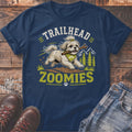 Shih Tzu with stick in mouth on shirt with "TRAILHEAD ZOOMIES" text.