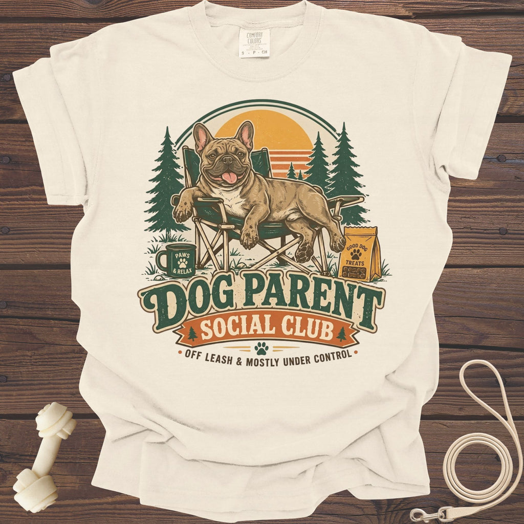 French bulldog relaxing in a camp chair with text "Dog Parent Social Club".