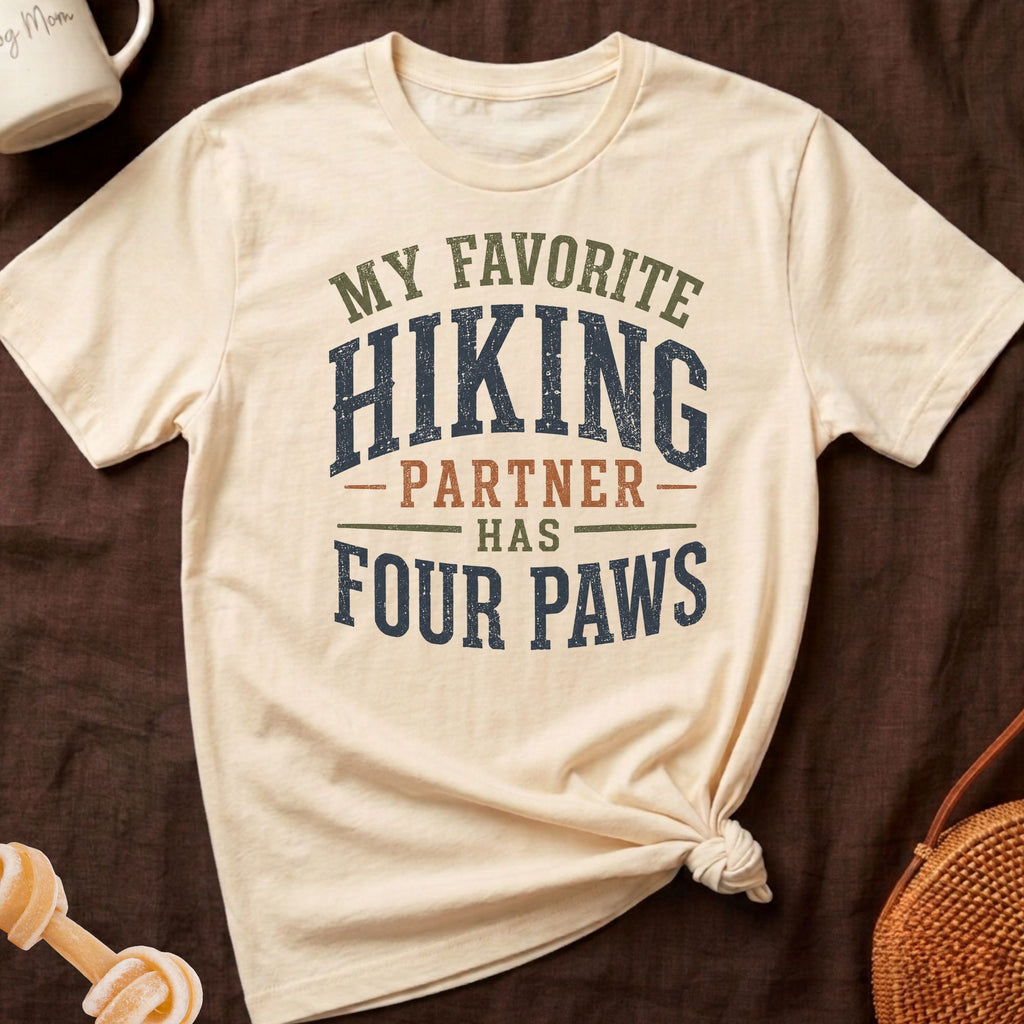Cream t-shirt with "My favorite hiking partner has four paws" graphic.
