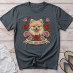 Pomeranian dog with roses and text "LOYAL LOVE BLOOMS" on a dark grey t-shirt.