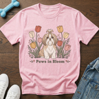 Pink t-shirt with a Shih Tzu dog sitting among tulips, text reads "Paws in Bloom".