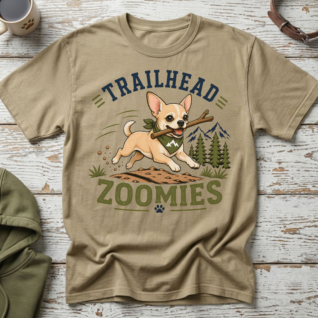 Chihuahua with stick running on dirt, text "TRAILHEAD ZOOMIES"