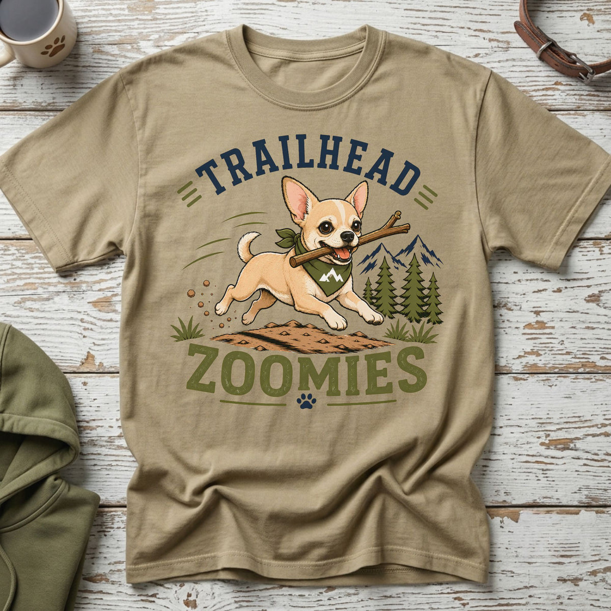 Chihuahua with stick running on dirt, text "TRAILHEAD ZOOMIES"
